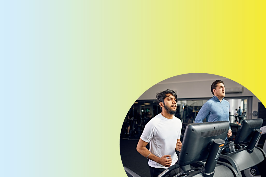 Two people running on the treadmill