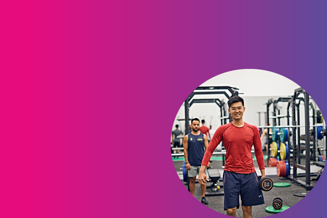 Student exercising using dumbbell