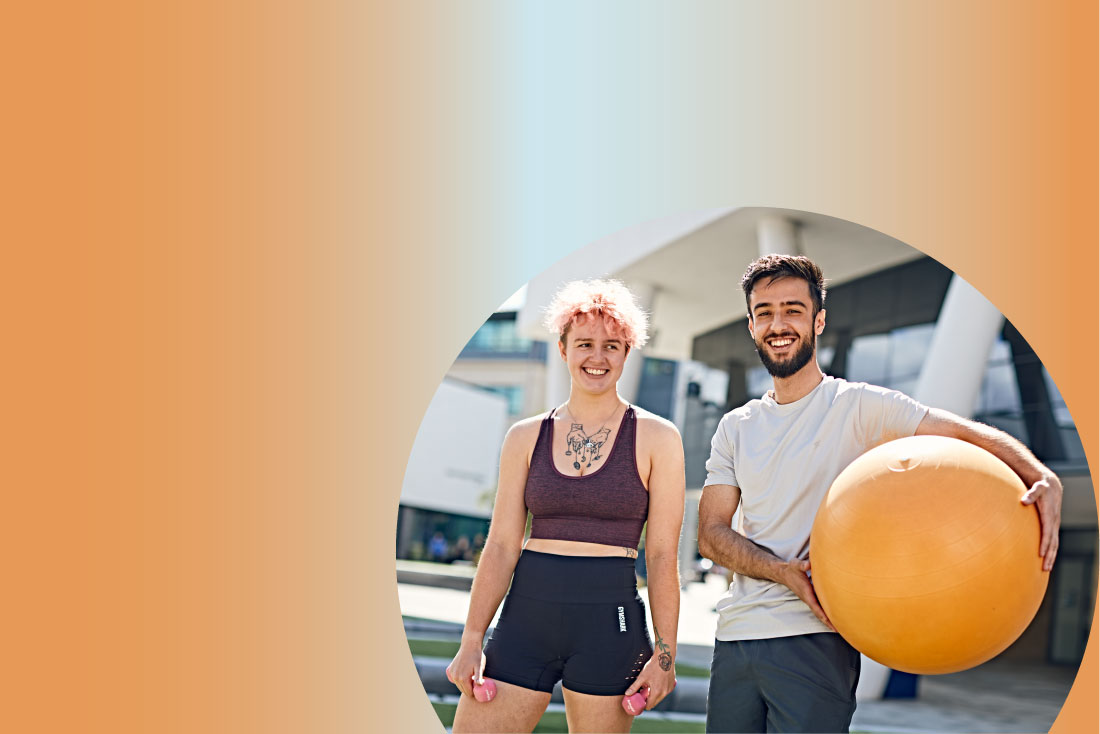 Two people holding workout equipment