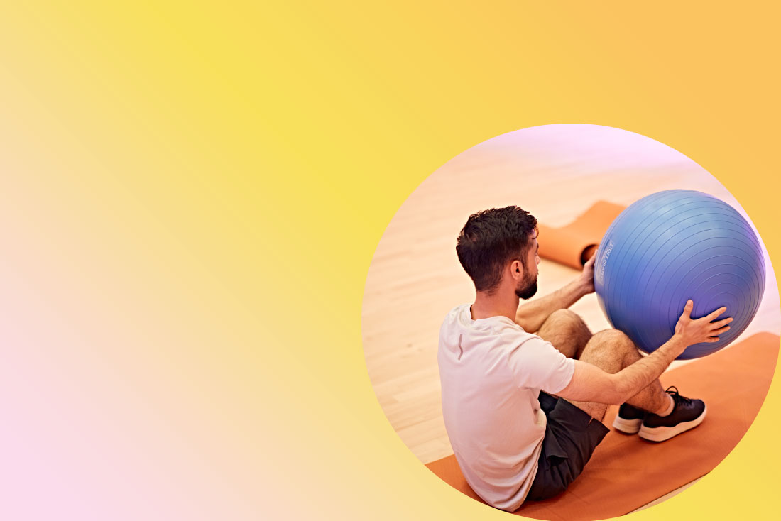 student exercising with bouncing ball