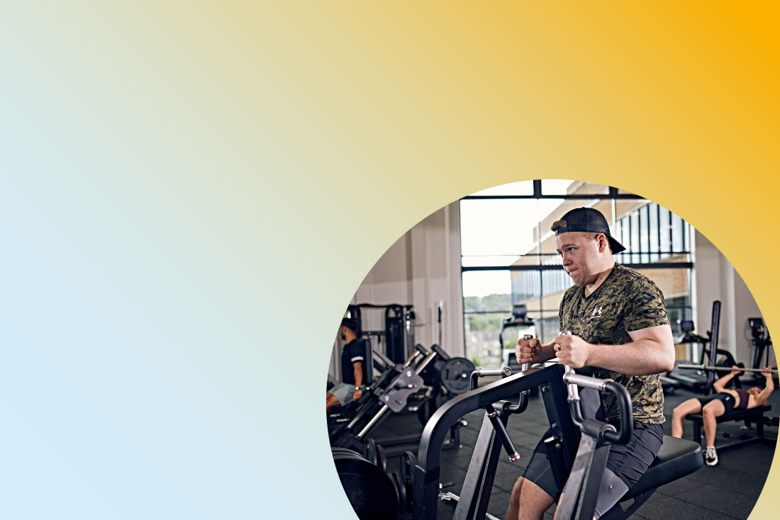 Student exercising with machine in the gym