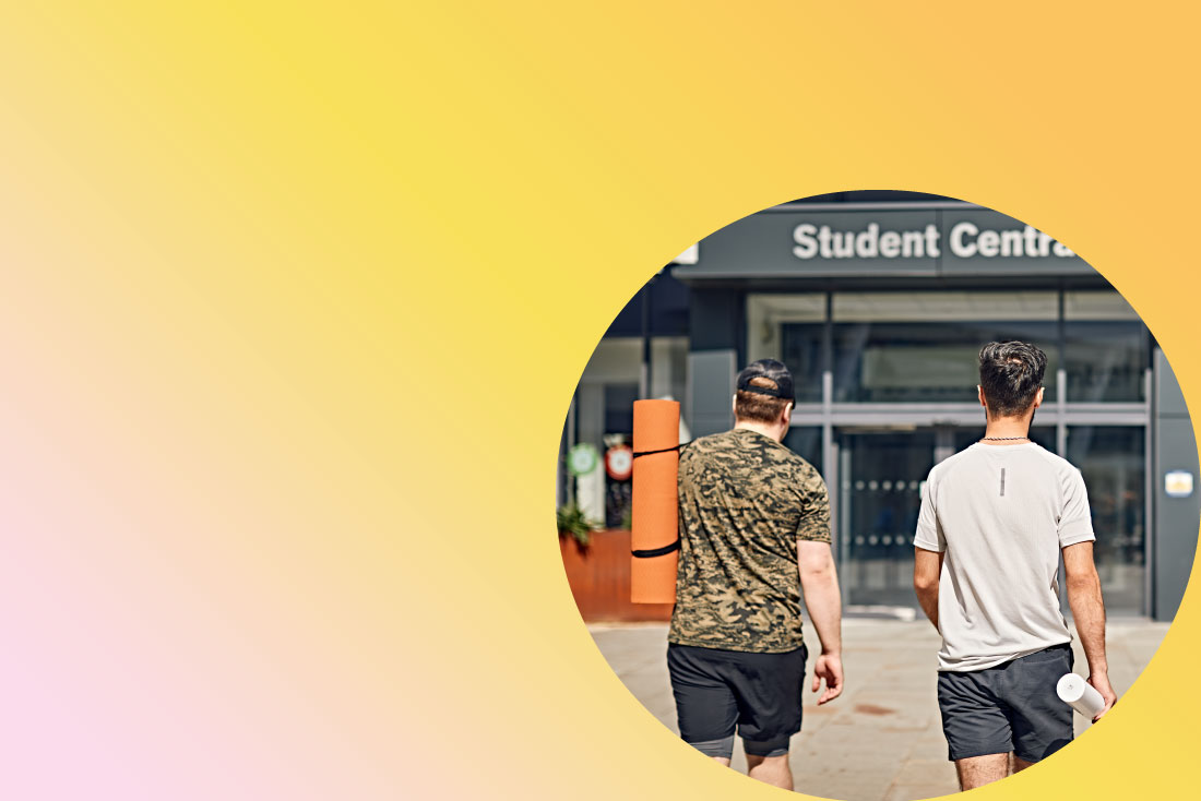 Students in gym fit on the way to the gym in front of student central
