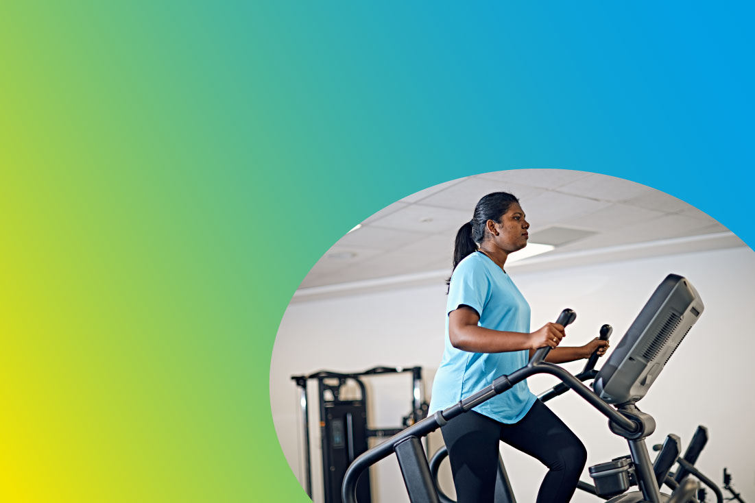 Student exercising on step machine in gym